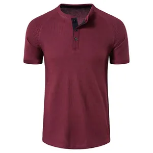 Detail of a men's burgundy short-sleeved Henley shirt with waffle knit texture fabric