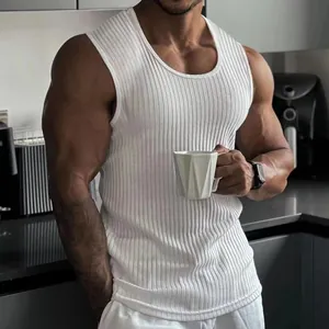 Close-up of white ribbed fitness tank top showing muscle-fit texture and slim cut