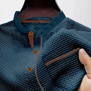 Close-up of blue men's henley shirt featuring breathable textured ice silk fabric