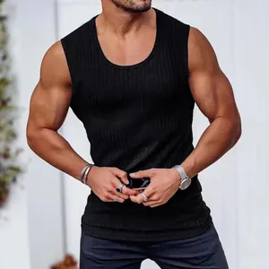 Detailed close-up view of a black ribbed fitness tank top worn by a muscular male model