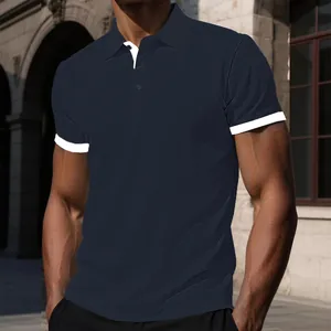 Detailed shot of a navy blue breathable men's polo shirt with contrast white trim.