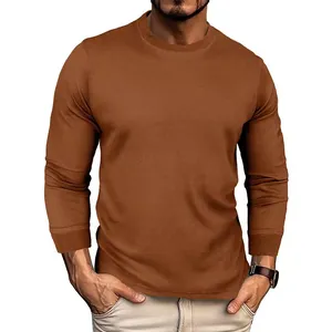 Detailed macro view of the brown waffle knit fabric on men's long sleeve crew neck shirt