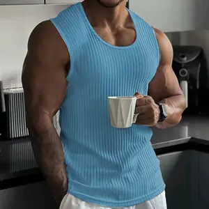 Macro view of the blue ribbed slim fit fitness tank top on a muscular male model
