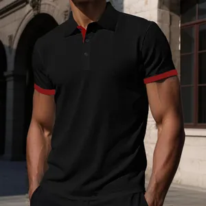 Detail of men's black knit polo shirt with red trim and textured fabric.