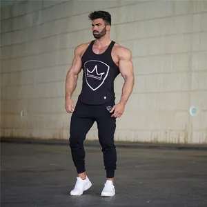 Full view of men's slim fit black jogger pants worn by an athletic model outdoors