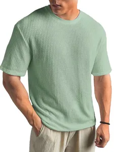 Close-up of textured jacquard knit fabric on a comfortable men's summer casual T-shirt