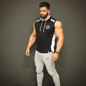 Model wearing grey slim fit joggers with white drawstring for casual athletic style
