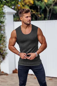 A detailed outdoor view of a charcoal grey ribbed stretch slim-fit athletic vest