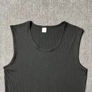 Macro detail of breathable black ribbed fabric on men's slim fit sports tank top