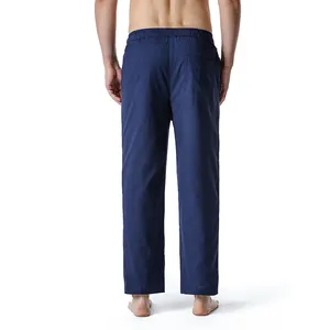 Back view of men's navy blue cotton linen casual pants featuring a comfortable elastic waist