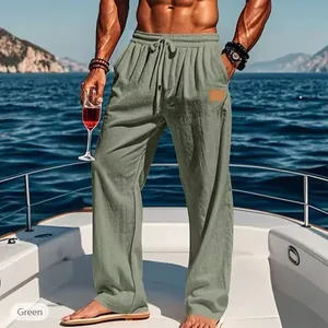 Men's green straight-leg casual pants with drawstring waist shown on a luxury yacht.
