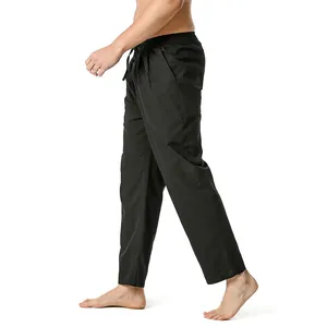 Side profile view of men's solid black linen-cotton casual cropped pants with drawstring