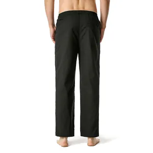 Rear view of men's black cotton linen casual straight-leg trousers in plain color