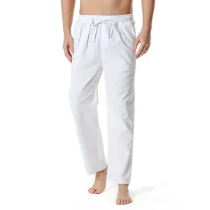 Close-up detail showing the texture and drawstring waist of men's white cotton linen trousers