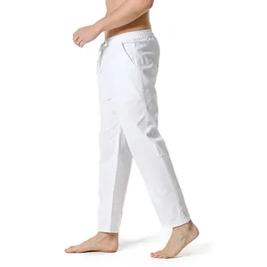 Side view of white cotton linen casual trousers for men with elastic waist and drawstring.