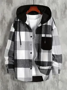 Close-up of men's black and white plaid hooded shirt with drawstring and chest pocket.