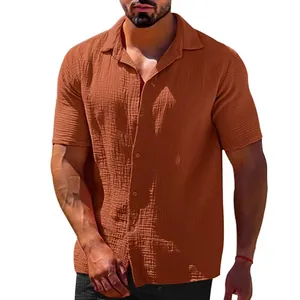 Detail shot of men's rust orange casual short sleeve lapel textured button-down shirt