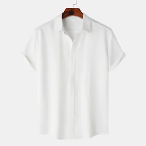 Detail view of the subtle jacquard texture on this white men's short-sleeved shirt
