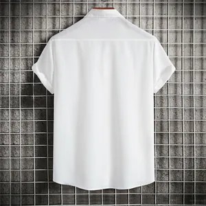 Back view of a white short-sleeve casual shirt with textured fabric on industrial grid
