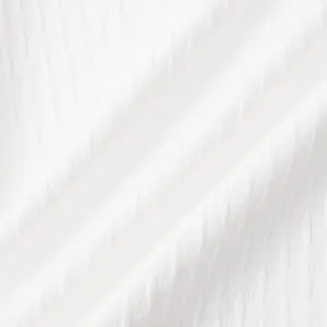 Close-up macro view of white jacquard fabric texture for men's summer shirt