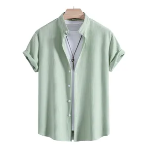 Close-up of a light green textured men's short sleeve shirt with mandarin collar on hanger