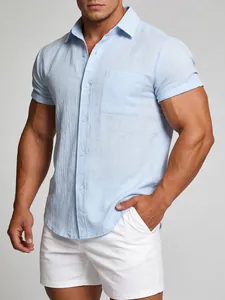 Detail of a light blue short-sleeved linen shirt for men with a single breast pocket