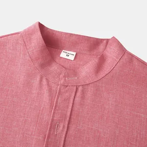 Close-up of pink linen-cotton shirt showing stand collar detail and fabric texture.