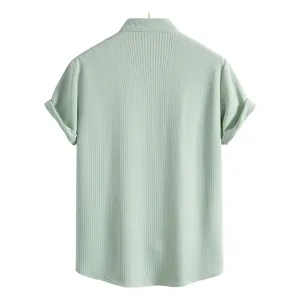 Back view of a light green short-sleeved casual shirt with textured ribbed fabric