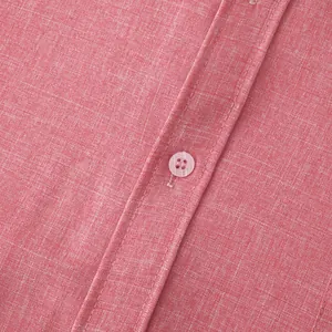 Macro view of red cotton linen fabric texture and button detail on men's shirt