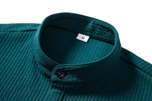 Close-up of men's casual shirt stand collar with textured fabric and black button