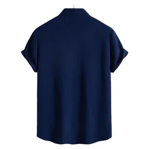 Detailed back view of a navy blue short sleeve shirt featuring vertical textured fabric