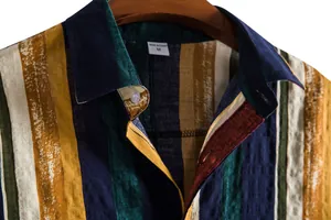 Macro view of colorful vertical stripes and collar on a men's breathable cotton shirt