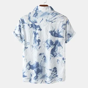 Back view of a white short-sleeved men's shirt with blue abstract ink smoke print.