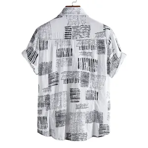 Back view of a men's white short sleeve shirt featuring black abstract geometric patterns.