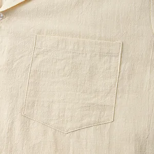 Close-up detail of pocket on beige cotton linen short sleeve shirt for men