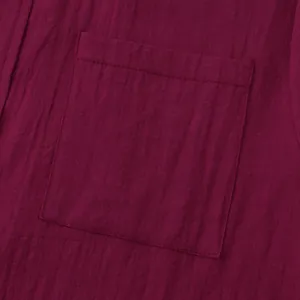 Macro detail of wine red cotton linen fabric and shirt pocket stitching