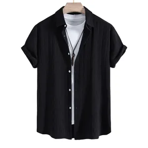 Stylish men's black short-sleeved summer shirt with jacquard texture on wooden hanger