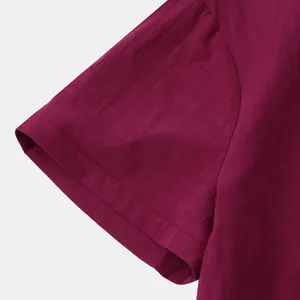 Detail view of the sleeve and breathable cotton-linen fabric of a men's shirt