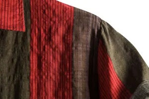 Macro view of the textured vertical striped fabric on a men's summer casual shirt