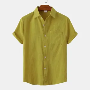 Detail view of a men's solid yellow-green cotton-linen short-sleeved button-down shirt