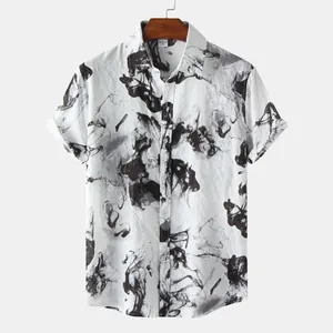 Close-up of men's short sleeve shirt featuring a black ink wash print on white