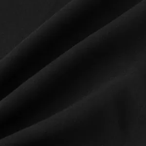 Primer plano detallado de la textura de tela negra de algodón y lino para camisa de hombre