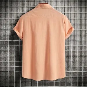 Back view of a peach-colored men's casual short sleeve shirt with textured fabric.