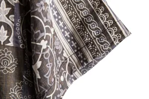 Close-up detail of vintage ethnic pattern and stitching on a mens short sleeve shirt cuff