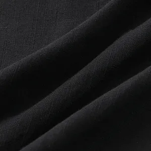 Close-up macro texture of breathable black cotton linen fabric for summer men shirt