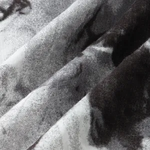 Macro view showing the breathable and soft printed fabric texture of the men's Hawaiian shirt