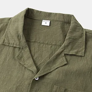 Close-up of olive green men's cotton linen short sleeve shirt showing collar and texture