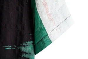 Close-up detail of a men's casual floral short-sleeve shirt showing fabric texture