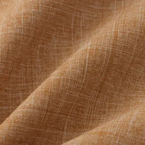 Primer plano macro de la textura de tela de algodón y lino amarillo mostaza transpirable.