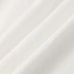 Macro detail of high-quality white cotton linen fabric texture showing natural breathable weave